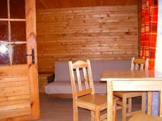 деревянные дачные домики база отдыха ночлеги на берегу озера в Польше Мазурские озера